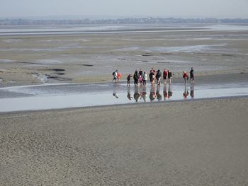 Group of people standing at beach