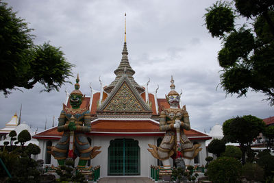 Temple building against cloudy sky
