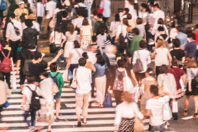 People looking at city street