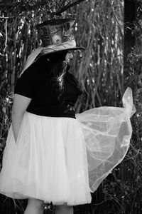 Side view of young woman wearing costume