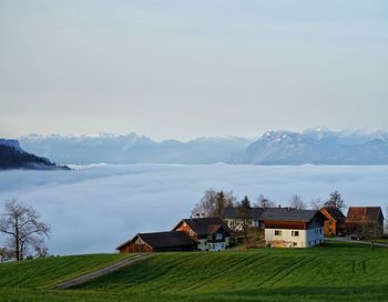 Austrian alpine village with a sea of clouds