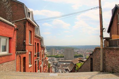 Buildings in city against sky