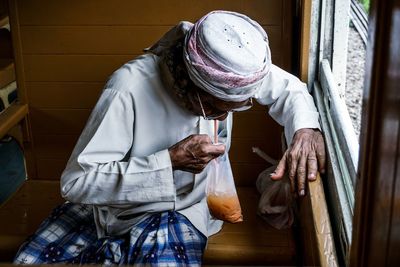 Midsection of woman holding food