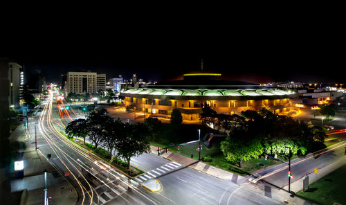 High angle view of city lit up at night