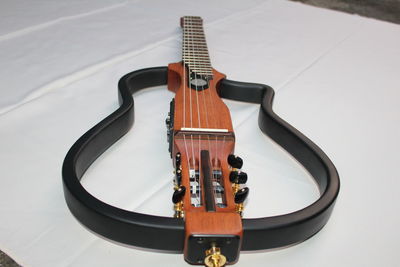 High angle view of guitar on table