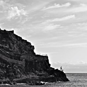 Scenic view of sea against cloudy sky