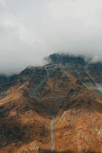 Aerial view of mountains against sky