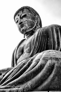 Low angle view of statue against sky