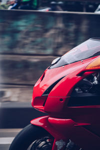 Close-up of red car on road