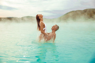 Happy couple in bleu lagoon, iceland