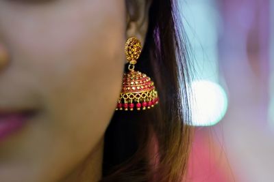 Close-up of woman wearing earring