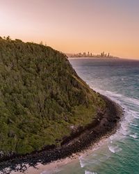 Scenic view of sea against clear sky during sunset