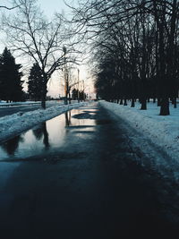 Scenic view of silhouette trees against sky during winter