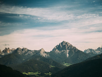 View of mountain range against cloudy sky