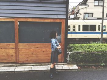 Man walking in front of house