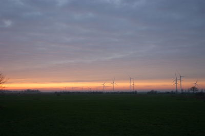 Scenic view of field against sky during sunset