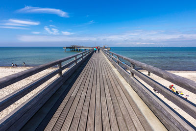 Pier over sea against sky