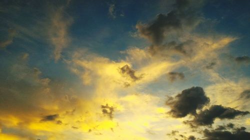 Low angle view of cloudy sky during sunset