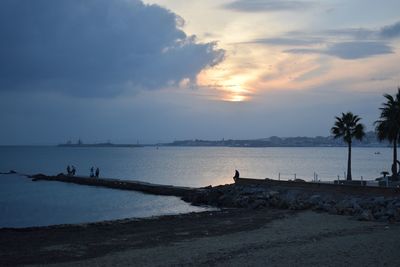 Scenic view of sea against sky at sunset