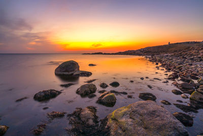 Scenic view of sea against sky during sunset