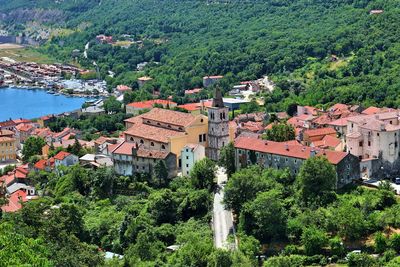 High angle view of townscape and trees in town