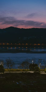 Scenic view of lake against sky during sunset