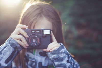 Young woman photographing