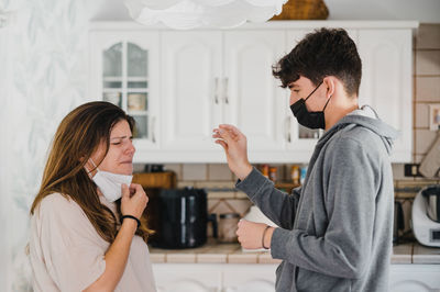 Side view of mother looking at sick mother