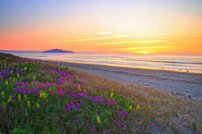 Scenic view of sea against sky at sunset