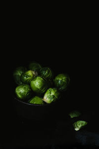 High angle view of green chili pepper against black background