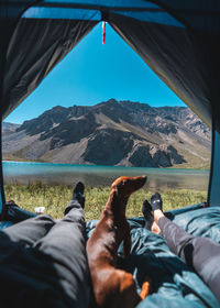 Low section of man lying on mountain