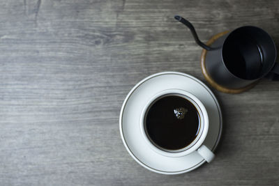 High angle view of black coffee on table