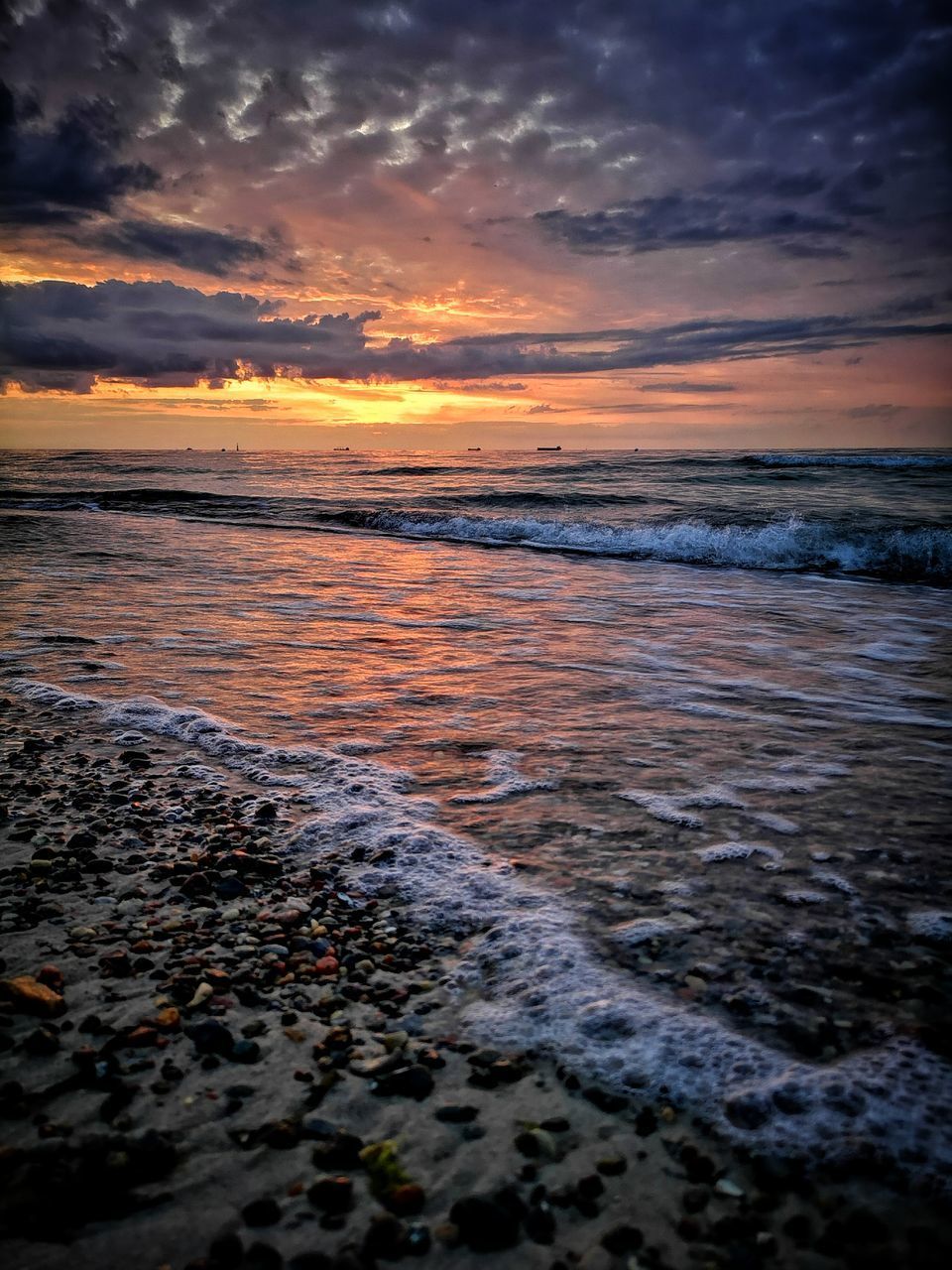 SCENIC VIEW OF SEA AGAINST ORANGE SKY