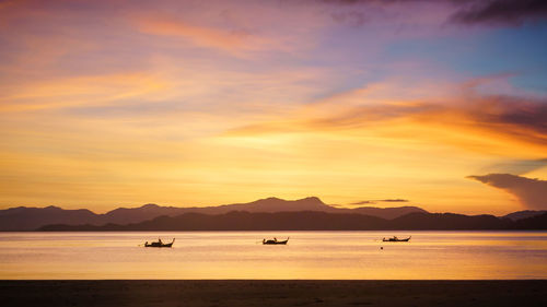 Scenic view of beach against sky during sunset