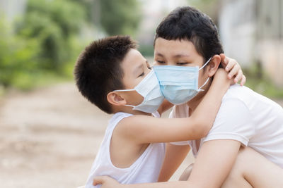 Portrait of couple kissing outdoors