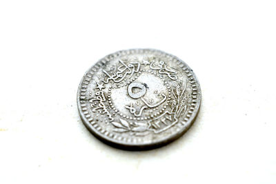 High angle view of coins on white background