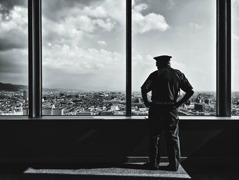 Cityscape against cloudy sky