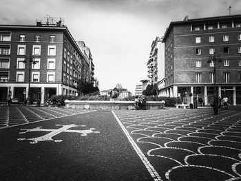 Road along buildings in city