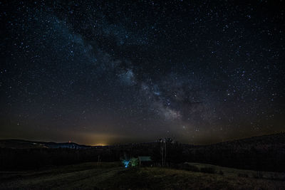 Scenic view of star field against sky at night