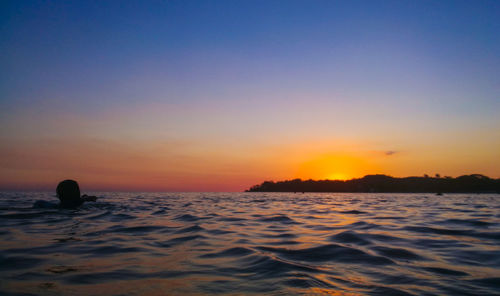 Scenic view of sea against sky during sunset