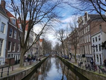 Canal amidst buildings in city