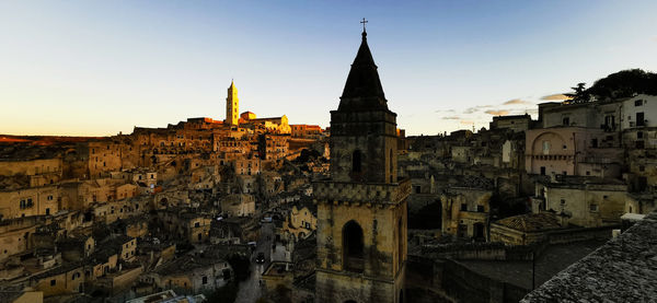 Panoramic view of buildings in city against clear sky