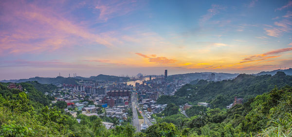 Panoramic view of townscape against sky during sunset