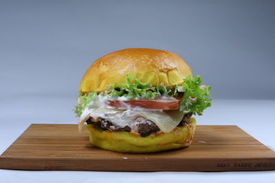 Close-up of burger on cutting board