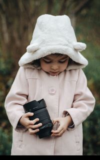 Full length of baby holding girl outdoors