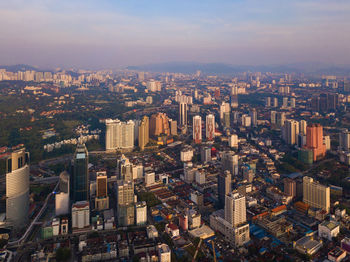High angle view of modern buildings in city against sky
