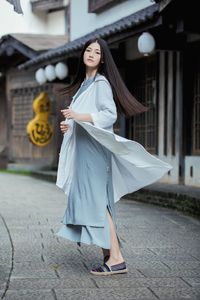 Full length of woman standing in park