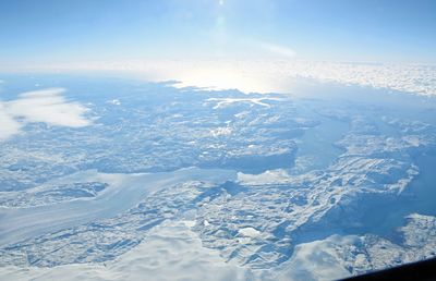 Aerial view of frozen landscape against sky