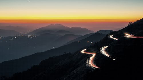 Scenic view of mountains against sky during sunset