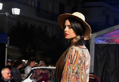 Portrait of young woman looking away